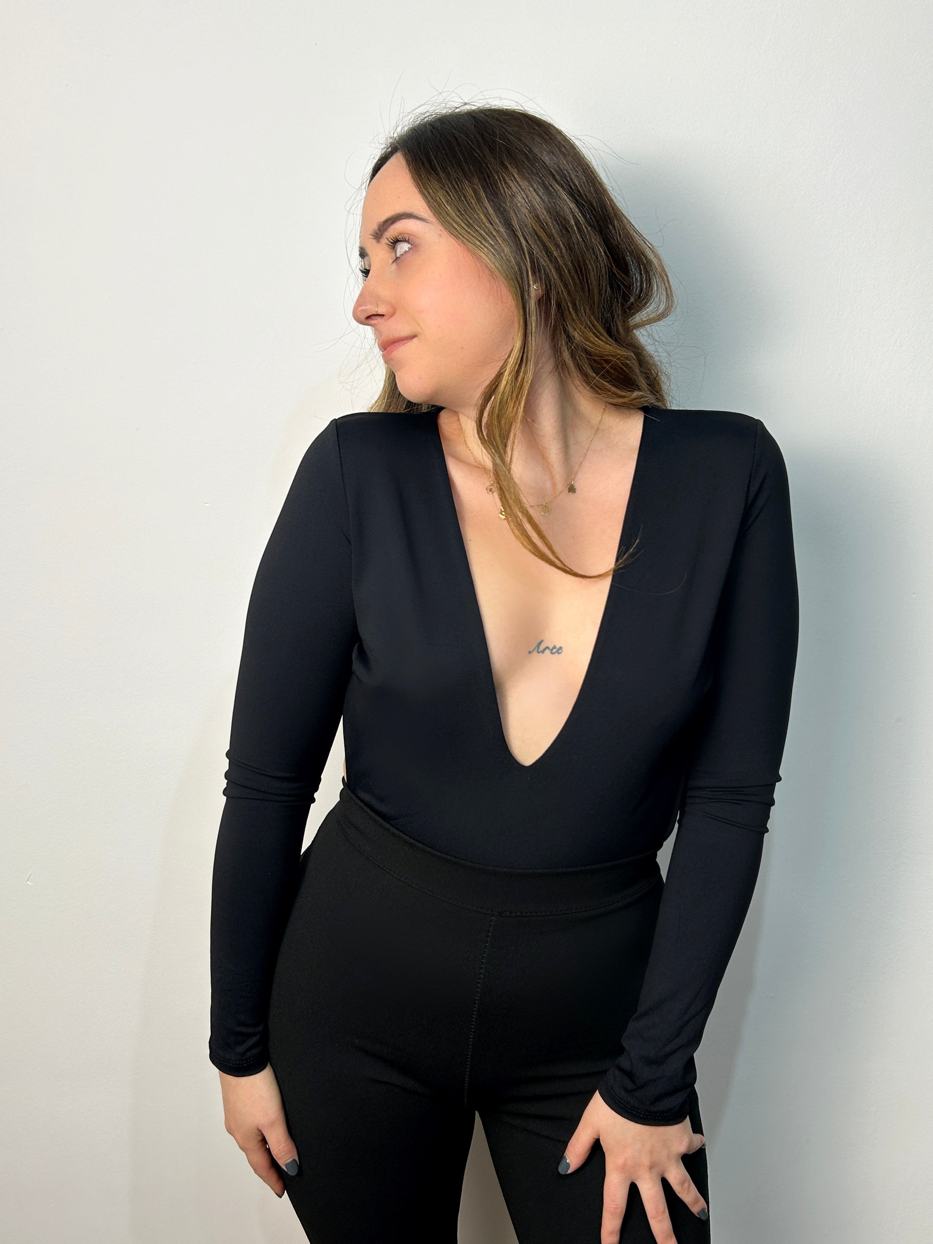 Body nero con scollo a rondella sul retro